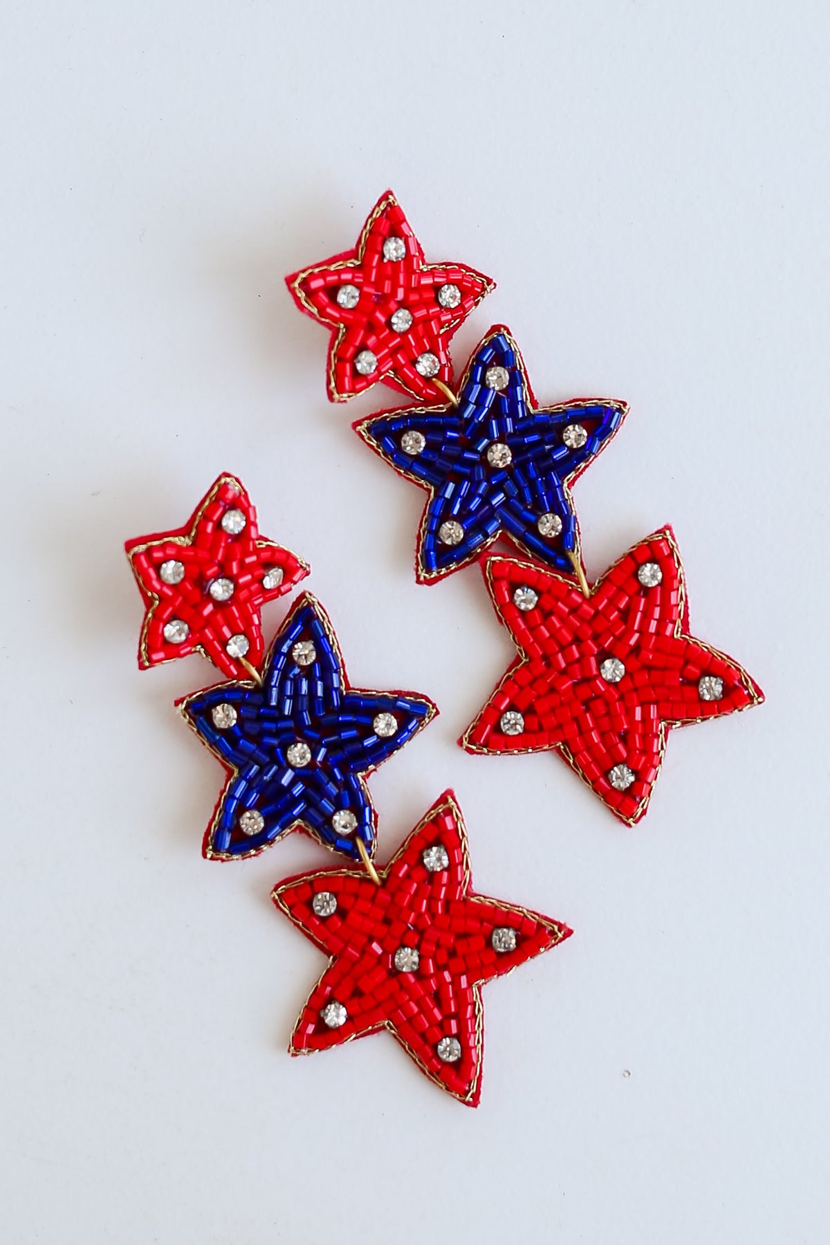 Red + Blue Beaded Star Drop Earrings flat lay