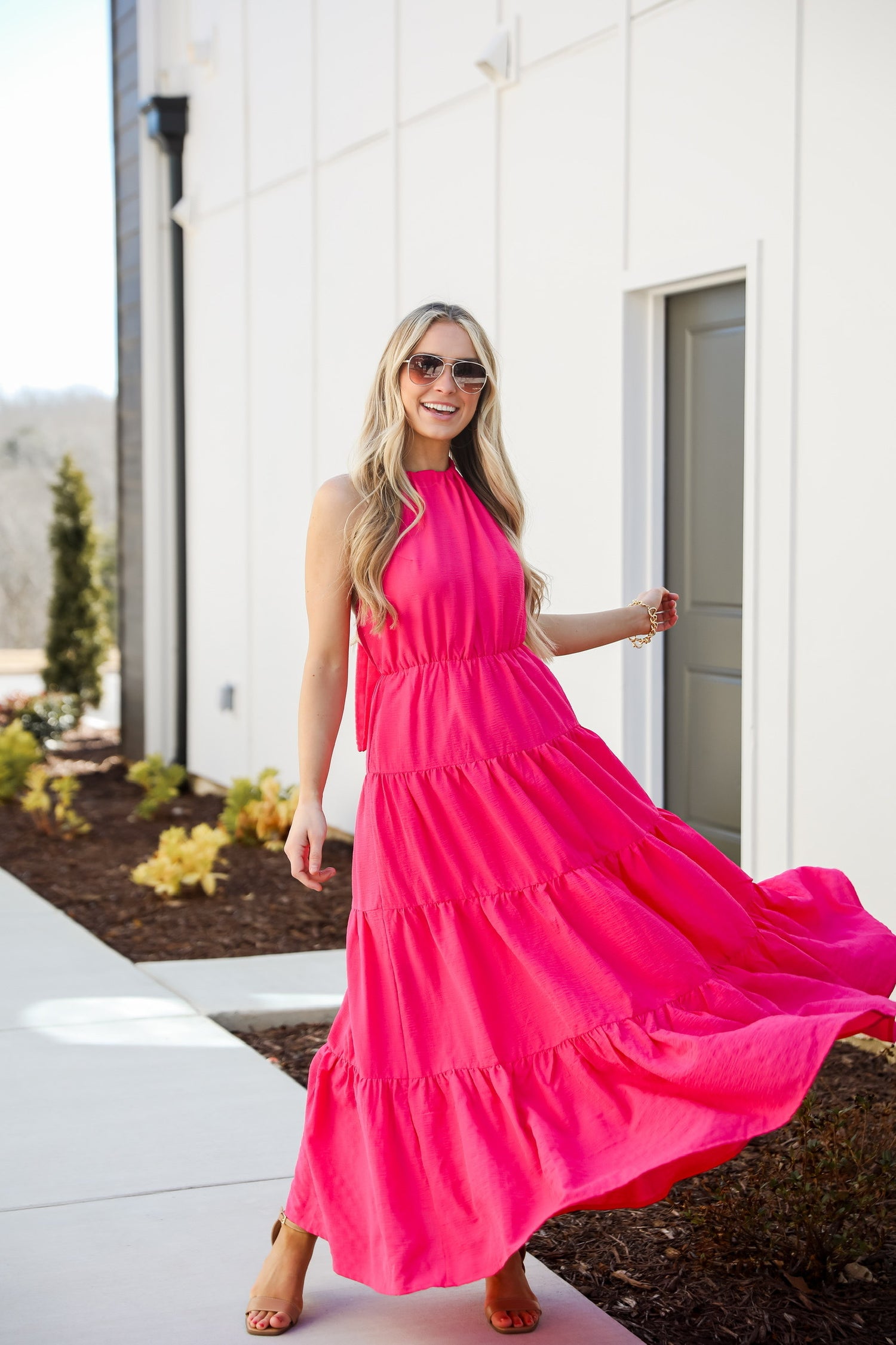 Ruby White Wear model in a pink maxi dress