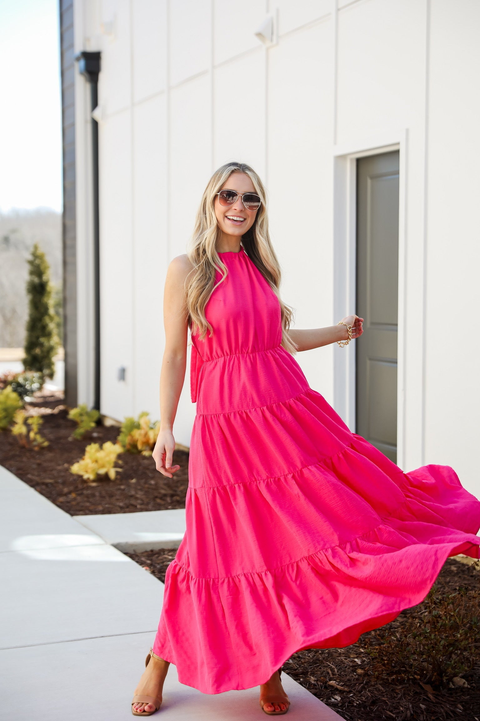 Ruby White Wear model in a pink maxi dress