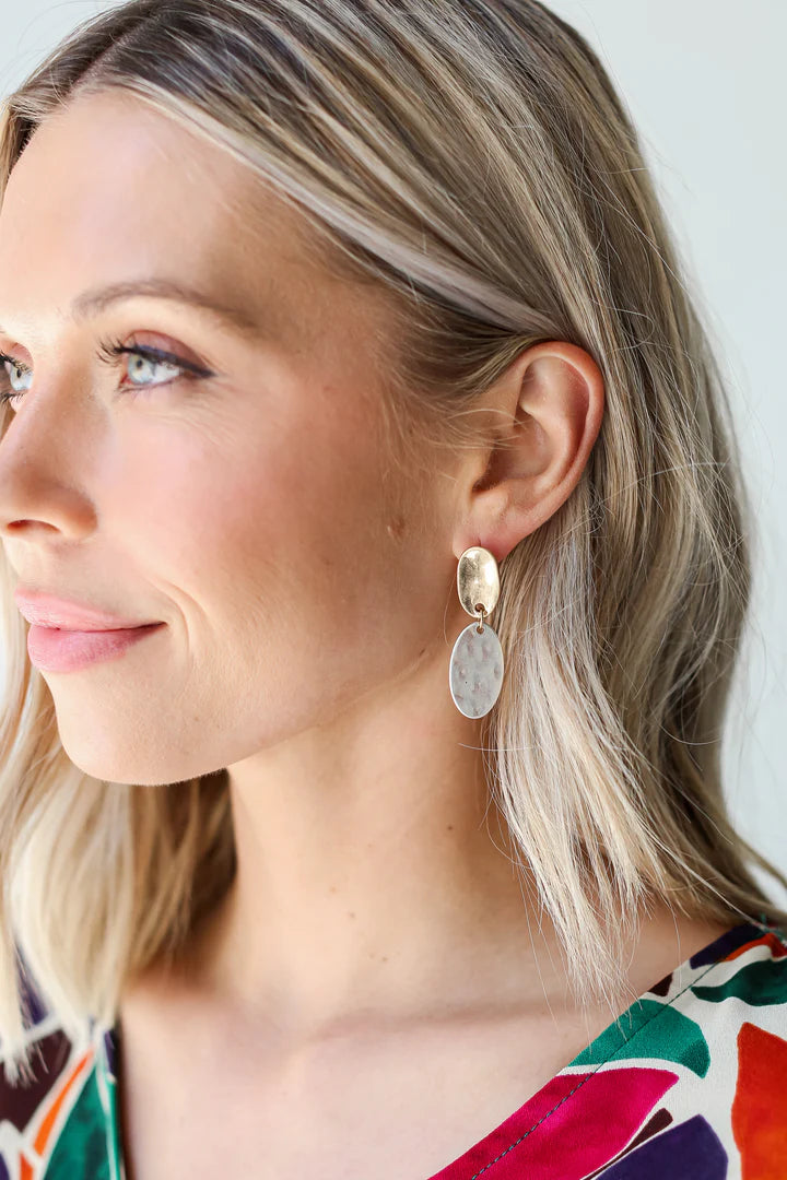 Close up of Ruby White Wear model showcasing earrings
