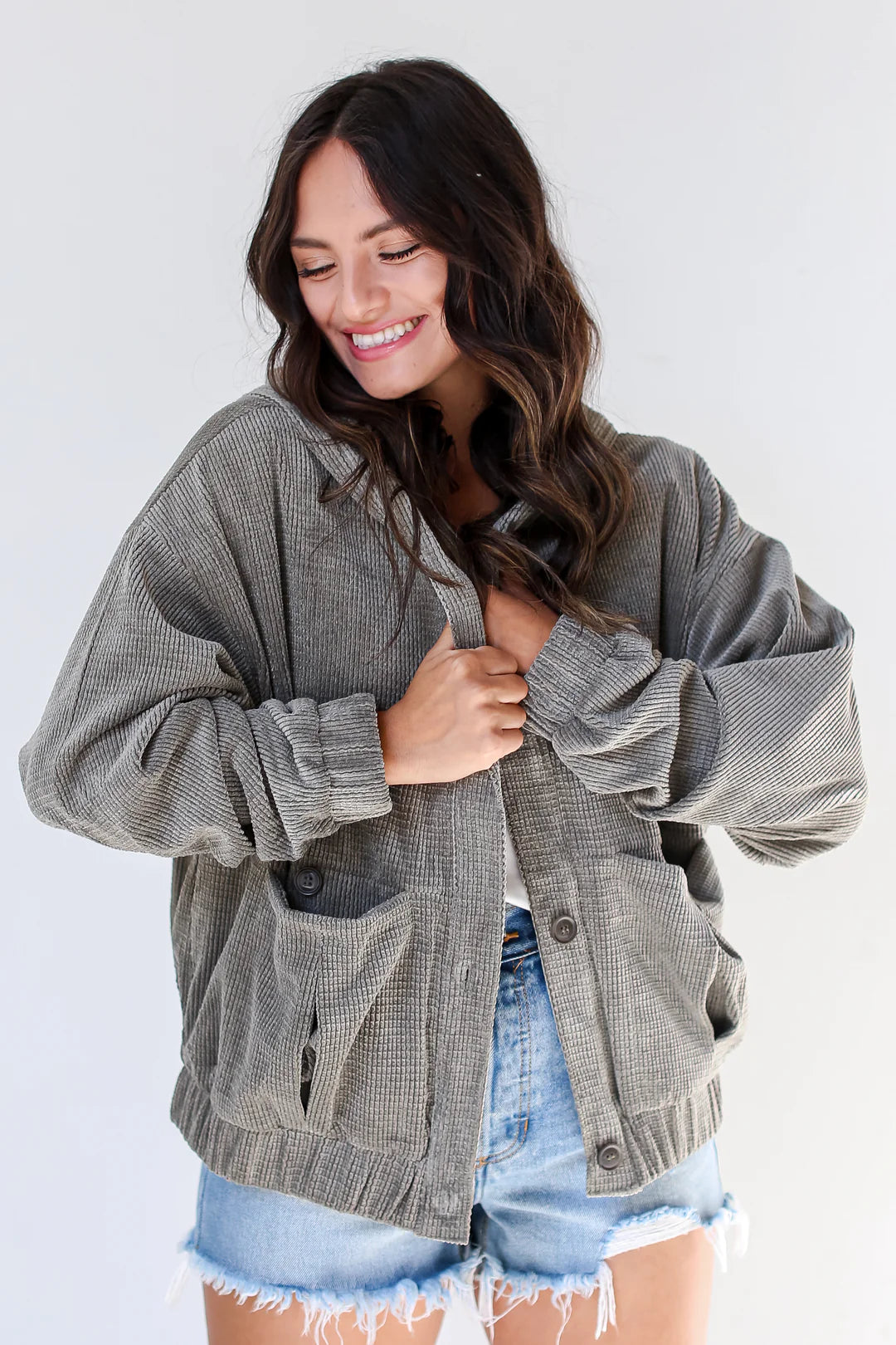 Ruby White Wear model in olive oversized jacket and jean shorts
