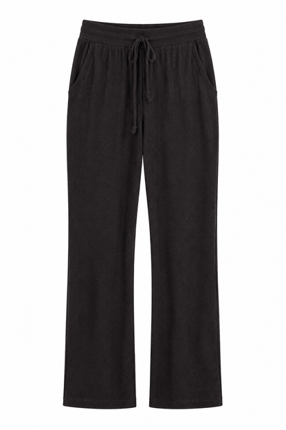 Black wide-leg lounge pants with an elastic drawstring waistband and side pockets, shown against a plain white background.