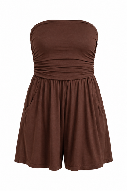 A brown strapless romper with a ruched bodice and flared shorts, displayed against a plain white background.