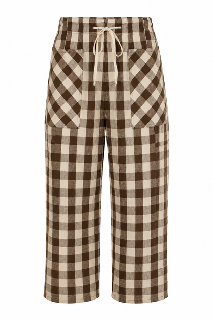Brown and beige checkered cropped pants with a drawstring waist and large front patch pockets, shown on a plain white background.