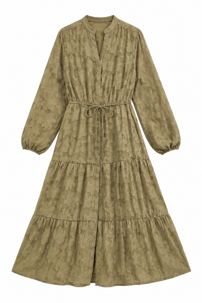 A long-sleeved midi dress in a textured olive green fabric with a tonal floral jacquard pattern, featuring a drawstring waist and tiered skirt, shown against a plain white background.