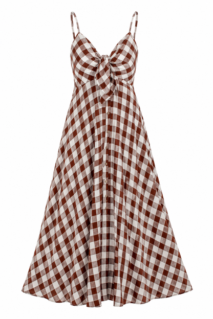 A sleeveless A-line midi dress with a brown and beige gingham check pattern, featuring spaghetti straps, a sweetheart neckline, and a large bow detail at the center bust.
