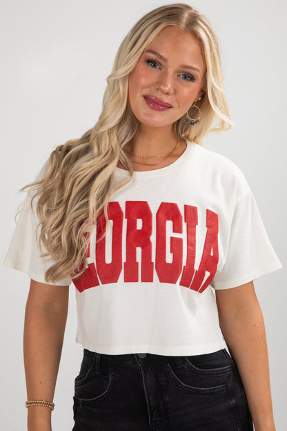 Woman wearing a white t-shirt with &