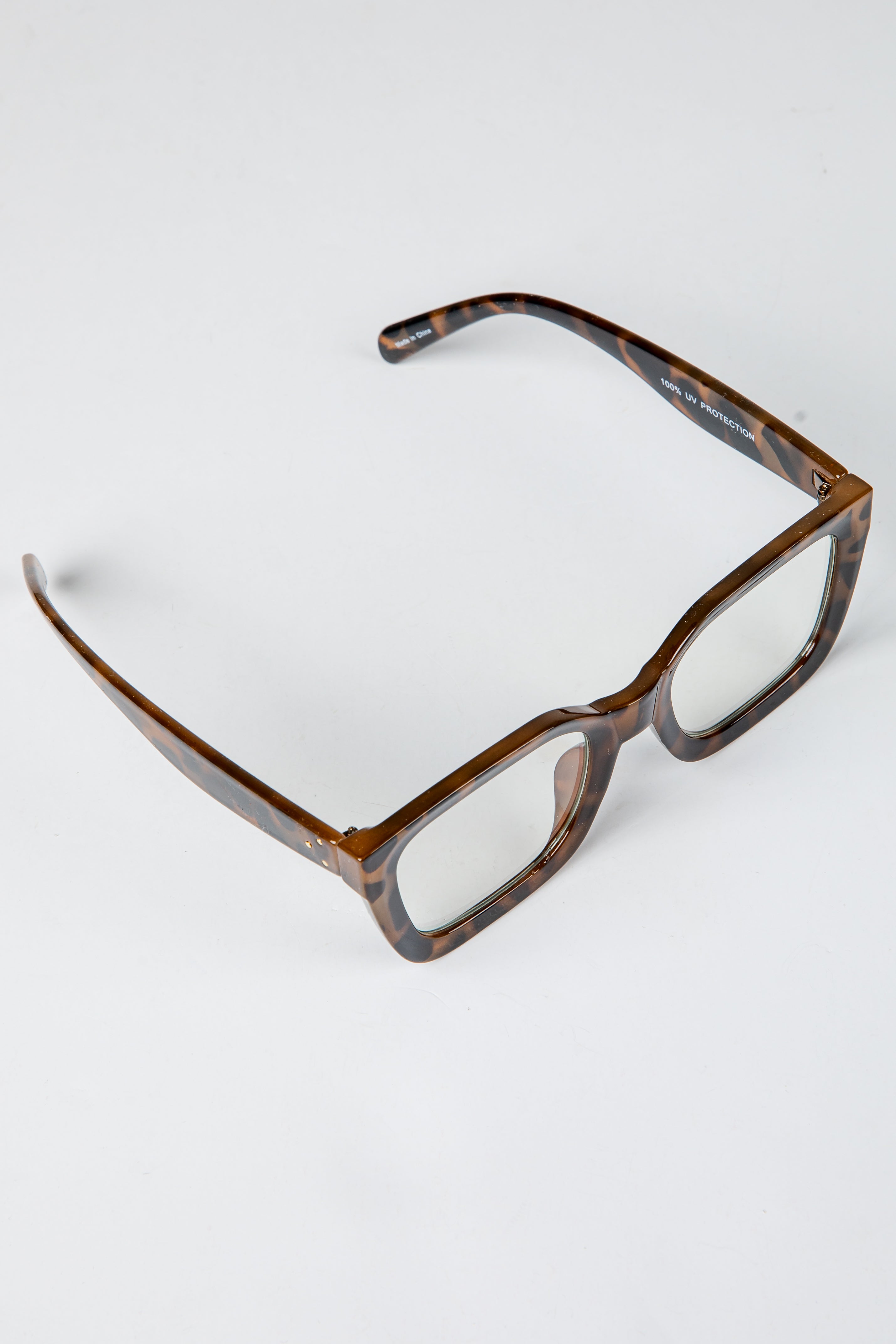 Brown eyeglasses on a white background