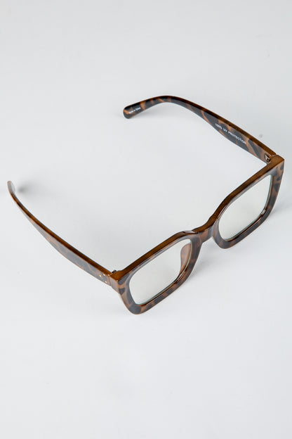 Brown eyeglasses on a white background