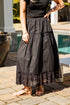 Black lace-trim maxi skirt styled poolside