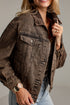 A woman wearing a dark brown acid-wash denim jacket over a beige top and light blue jeans, shown in a close-up lifestyle shot against a neutral studio background.
