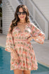 Woman wearing a floral dress by a poolside