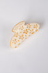 hair clip with floral patterns on a light gray background
