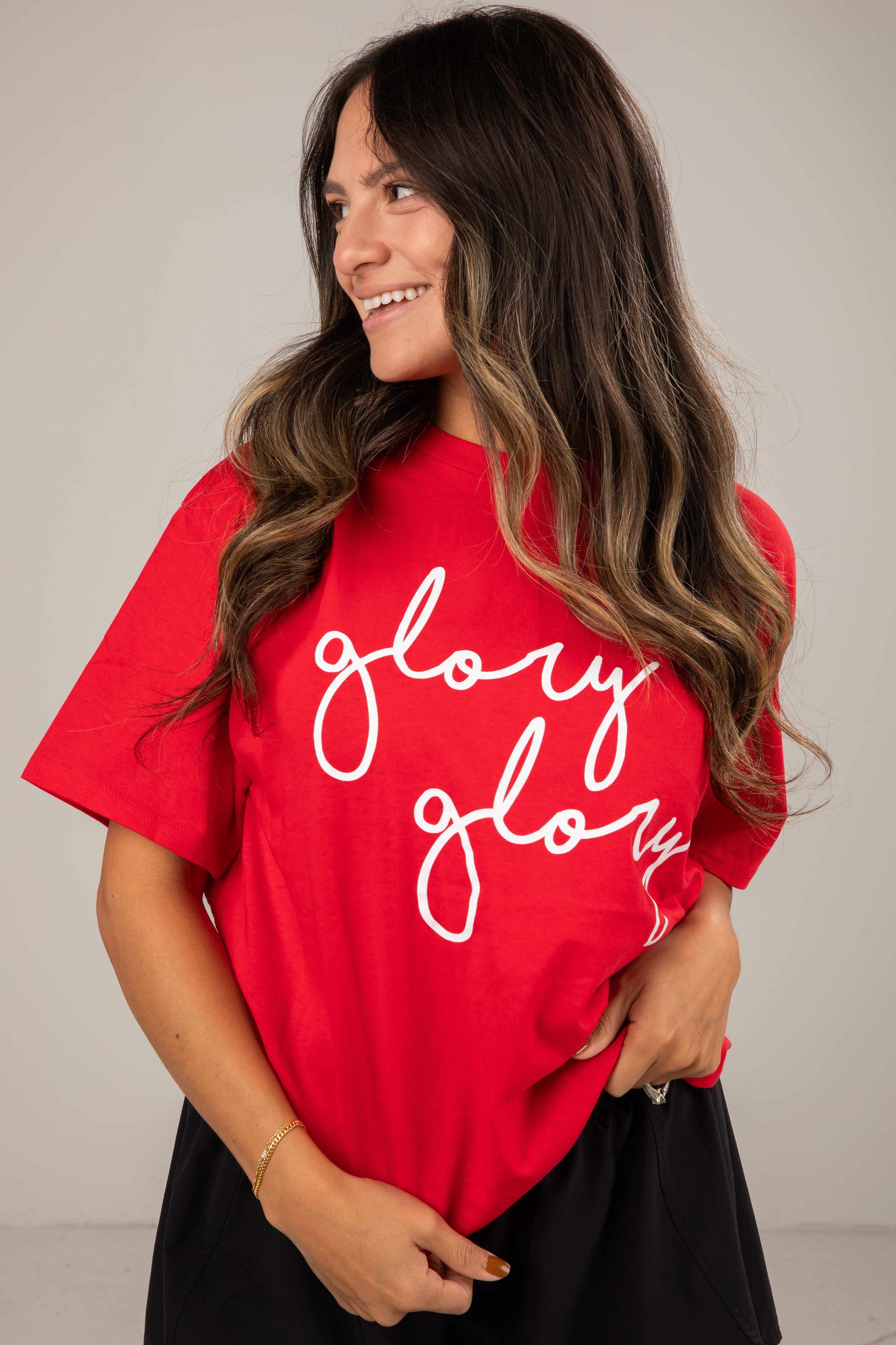 Woman wearing a red t-shirt with &