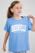 Young girl wearing a blue t-shirt with &