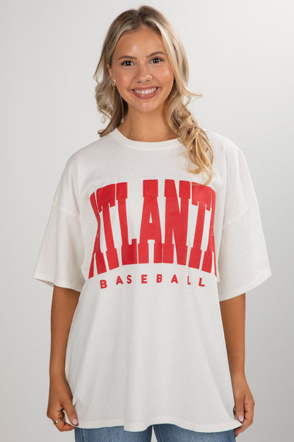 Woman wearing a white t-shirt with &