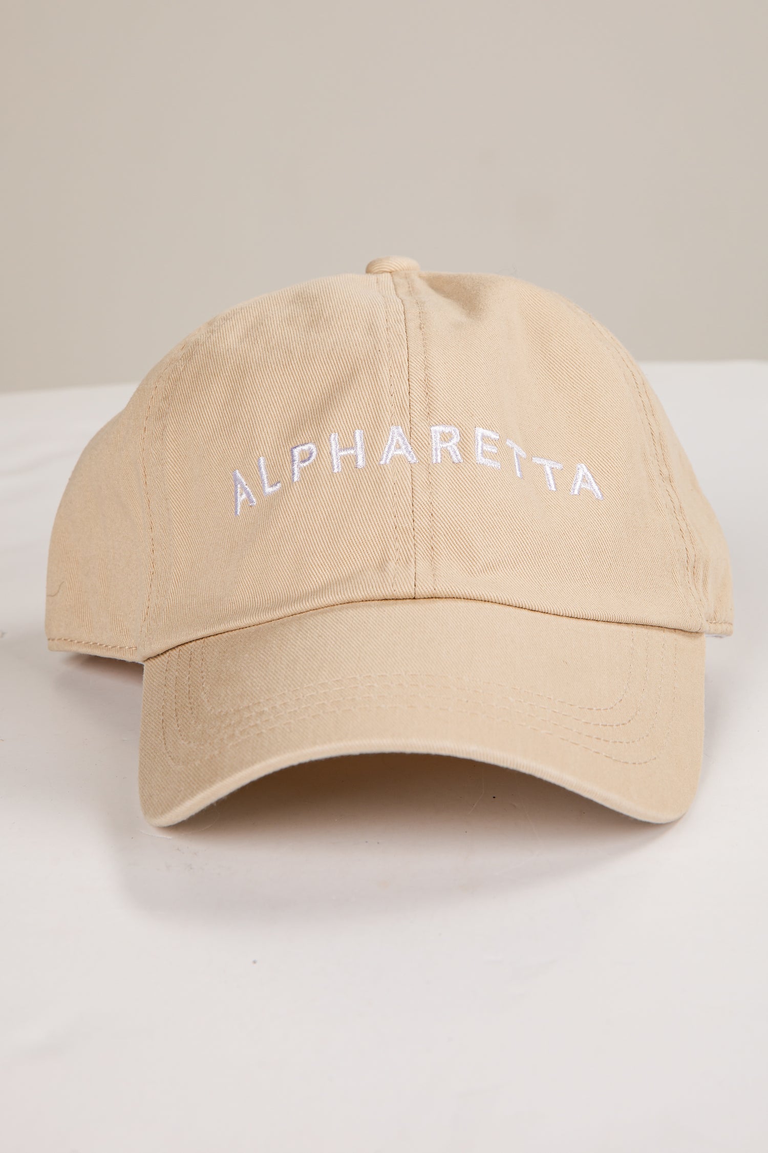 Beige cap with &