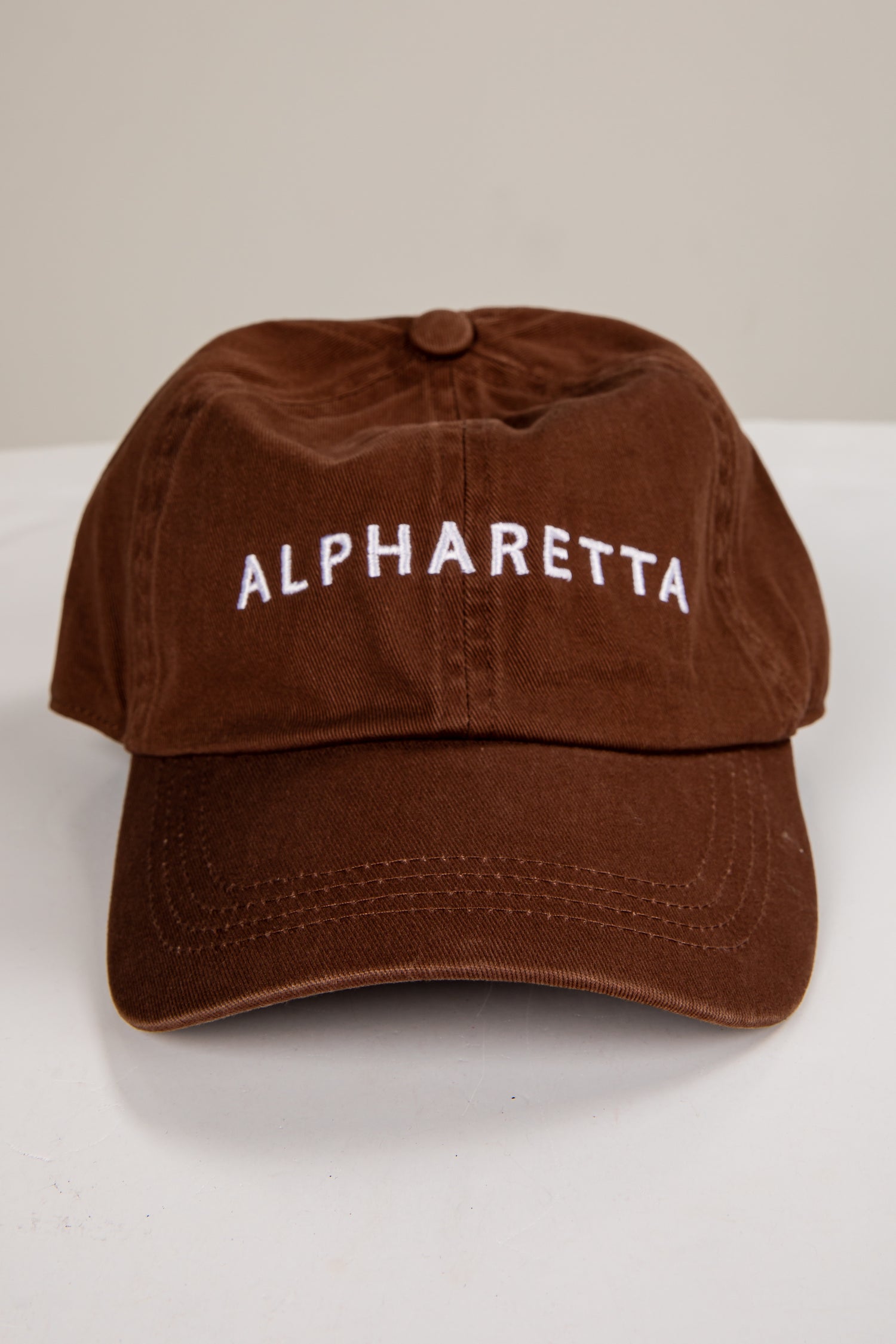 Brown cap with &