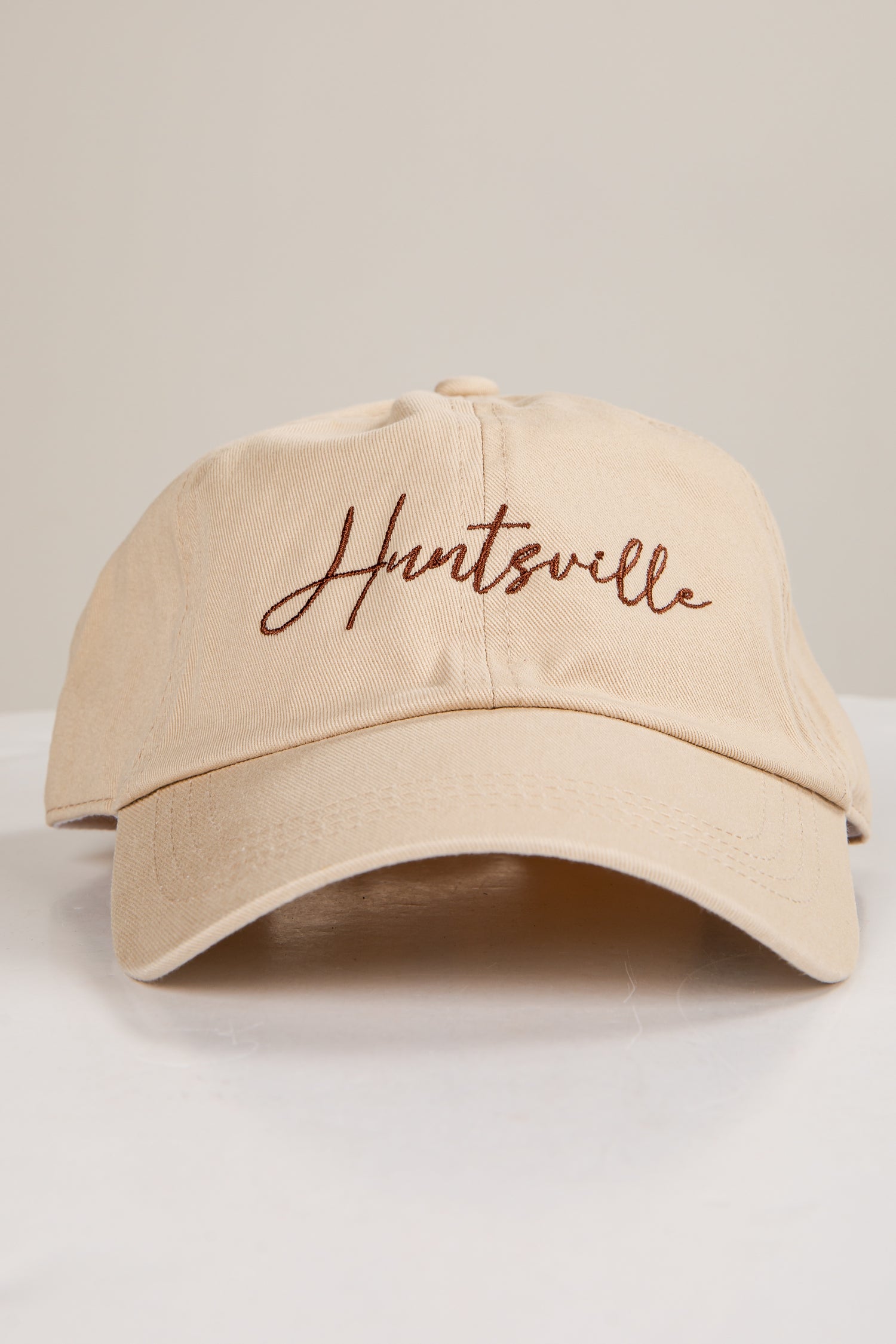 Beige cap with &