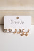Set of gold earrings on a &