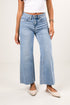 Light blue wide-leg jeans worn by a person on a white background
