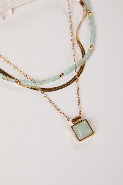 Gold and mint layered necklace with pendant