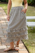 Woman wearing striped maxi skirt. 
