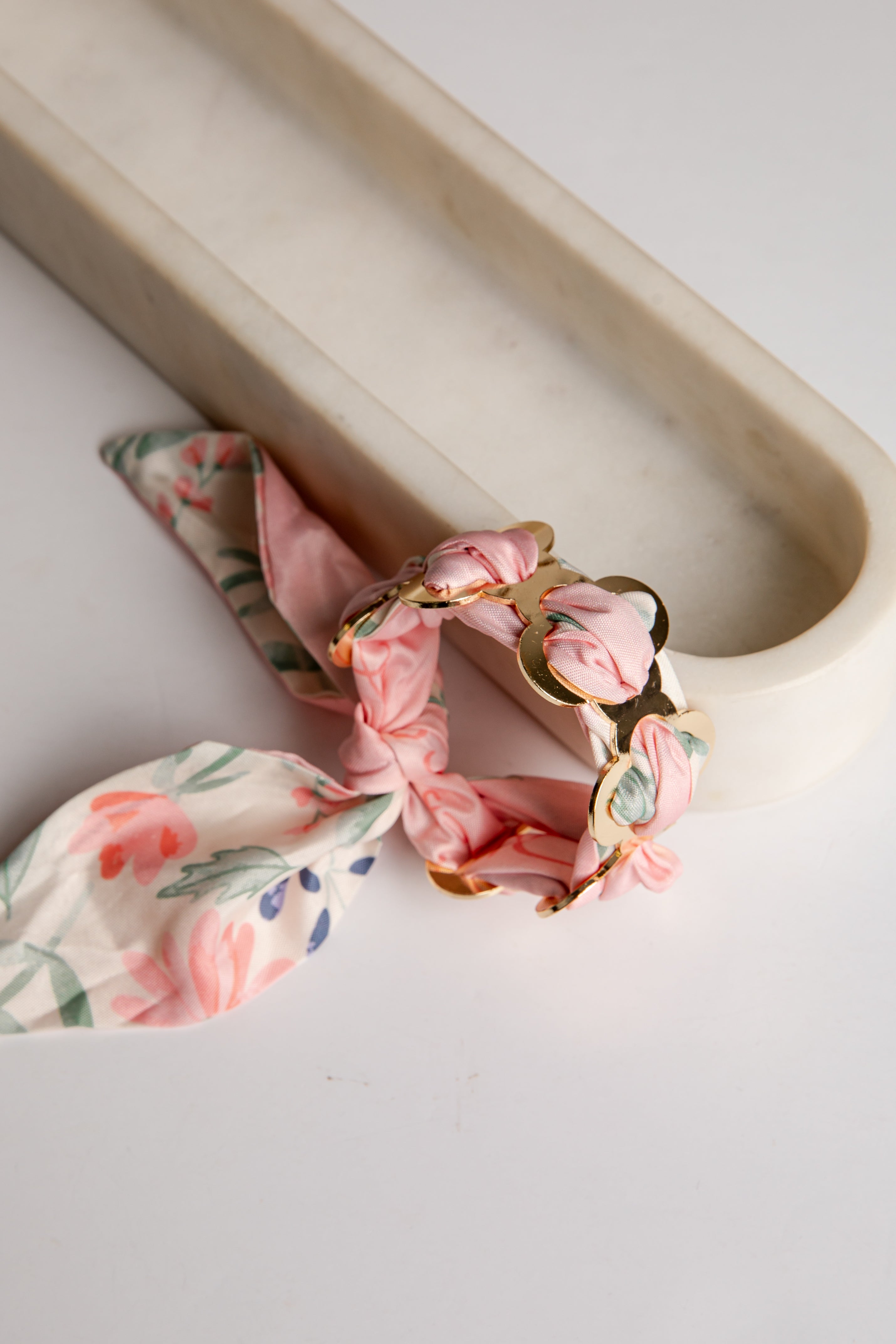 Floral bandana bracelet on a white surface