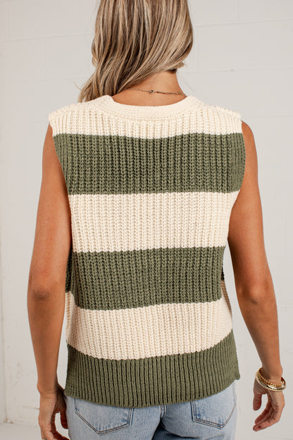 A woman shown from the back wearing a sleeveless ribbed knit sweater vest with horizontal stripes in olive green and cream, paired with light blue jeans.