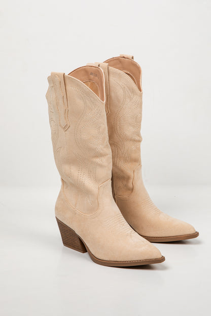 A pair of light beige faux-croc leather cowboy boots with pointed toes and low block heels, shown on a white studio background.