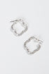 Pair of silver hoop earrings on a white background