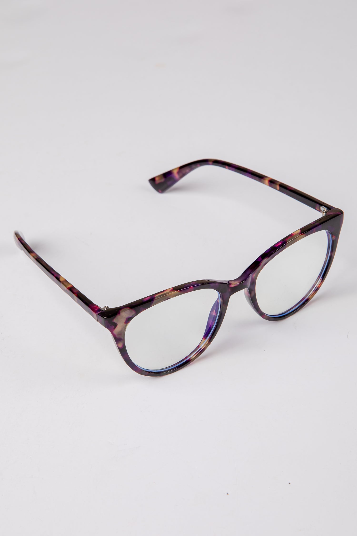 Tortoiseshell eyeglasses on a white background