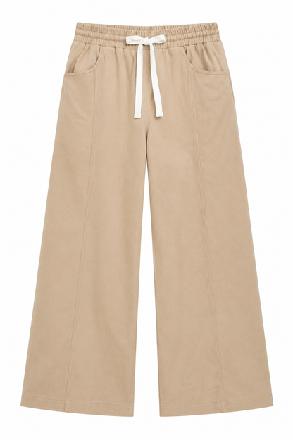 A pair of beige wide-leg cropped pants with an elastic waistband and a white drawstring bow, shown against a plain white background.