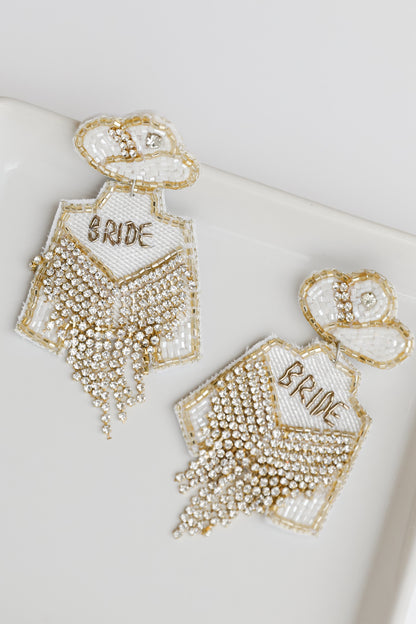 flat lay of white Cowgirl Bride Beaded Rhinestone Fringe Earrings
